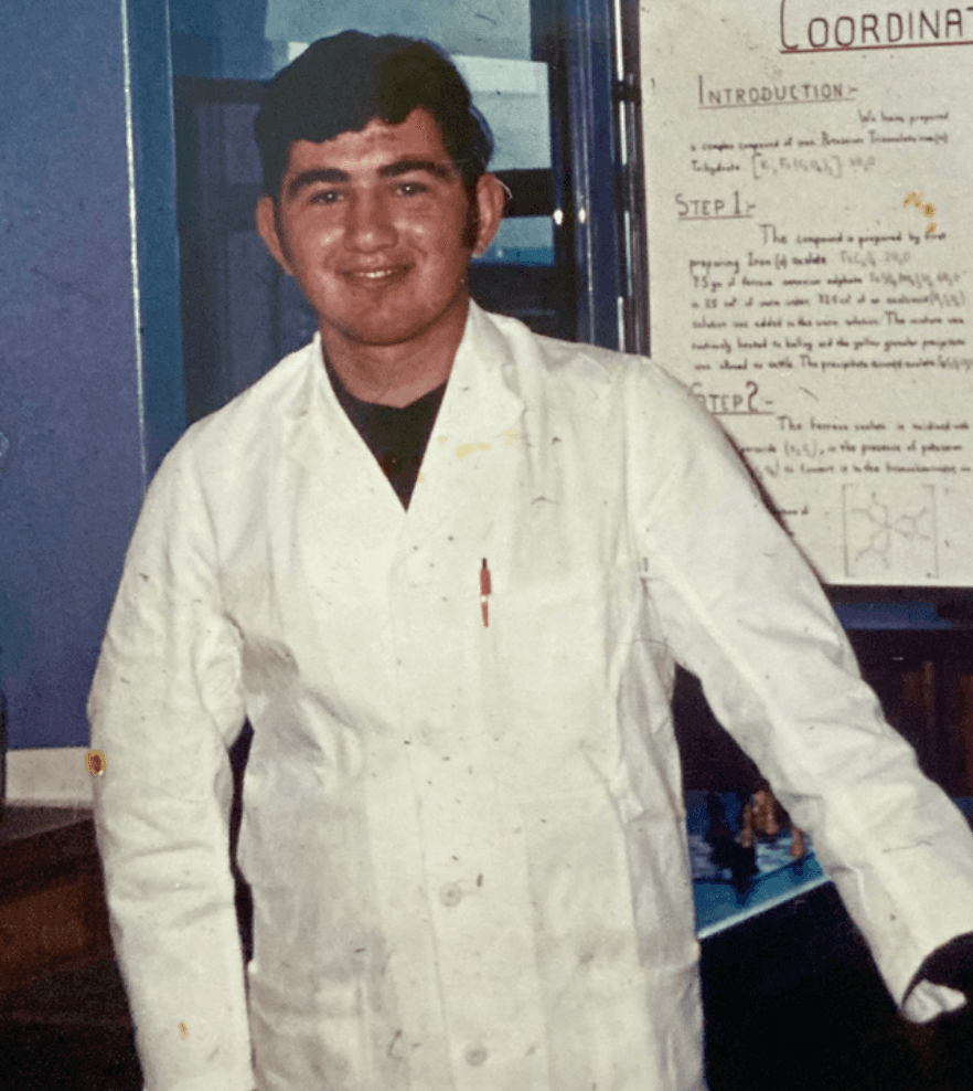 Nick Athanasopoulous in a white lab coat during his early science career